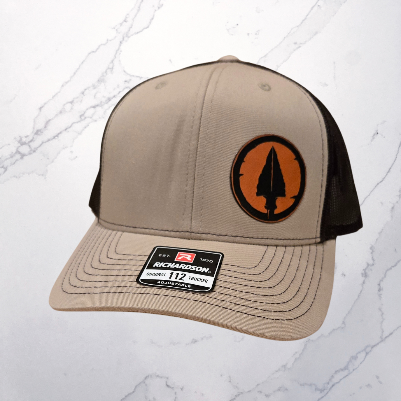 Richardson 112 Khaki/Brown Trucker Hat With Orange Circle Patch With Arrowhead