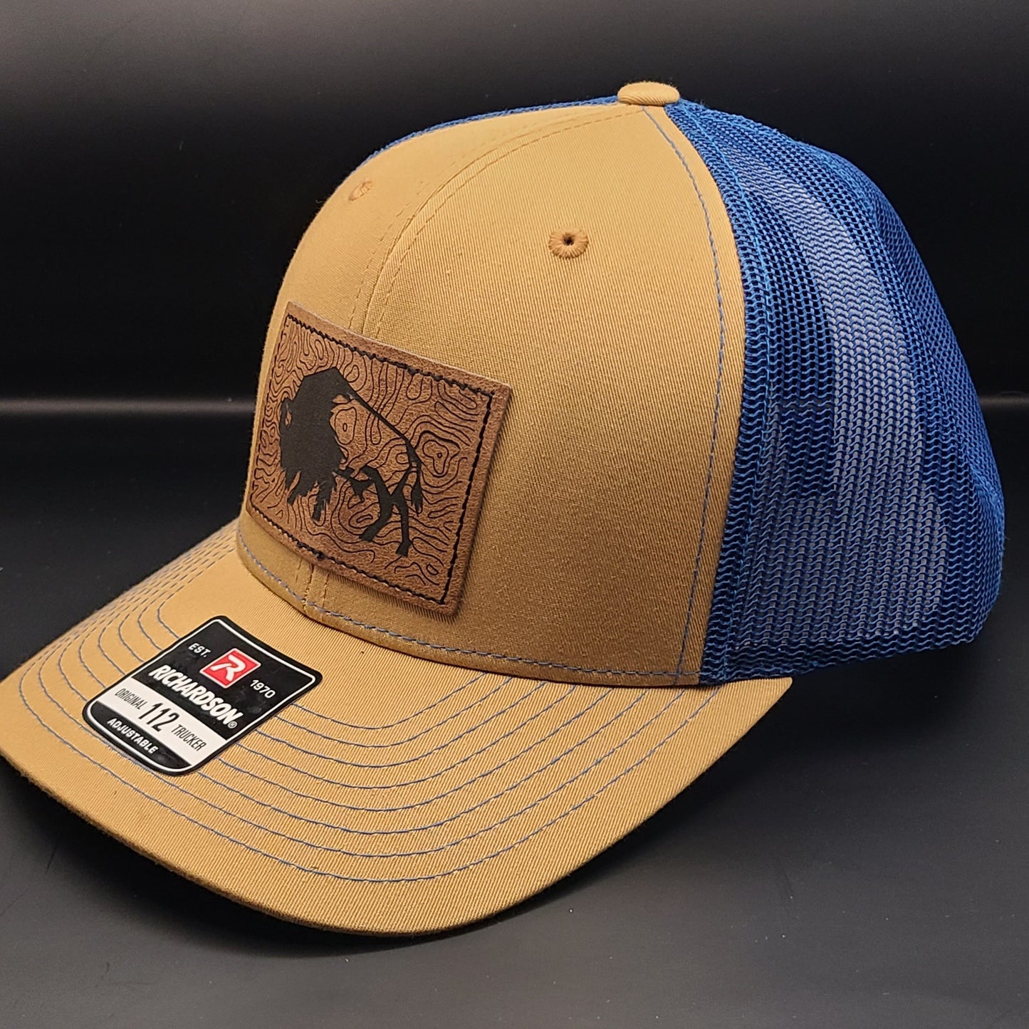 TRUCKER HAT WITH RECTANGLE BISON PATCH (BISCUIT/TRUE BLUE)